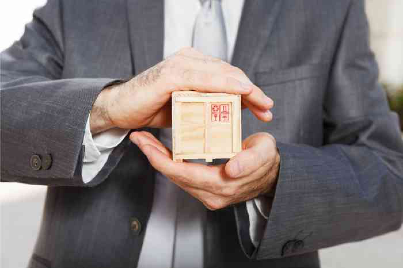 Crate Pro allows you to take control of your crating Man holding miniture wooden crate in his hands