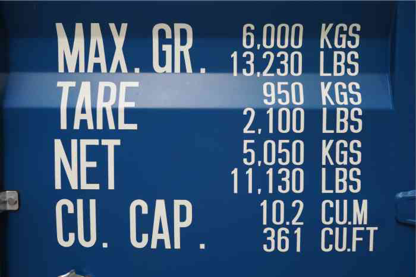 Weights and dimensions are given in imperial and metric Shipping container door showing imperial and metric